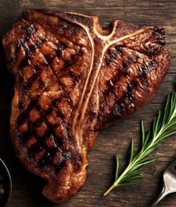 Grilled T-bone steak on wood